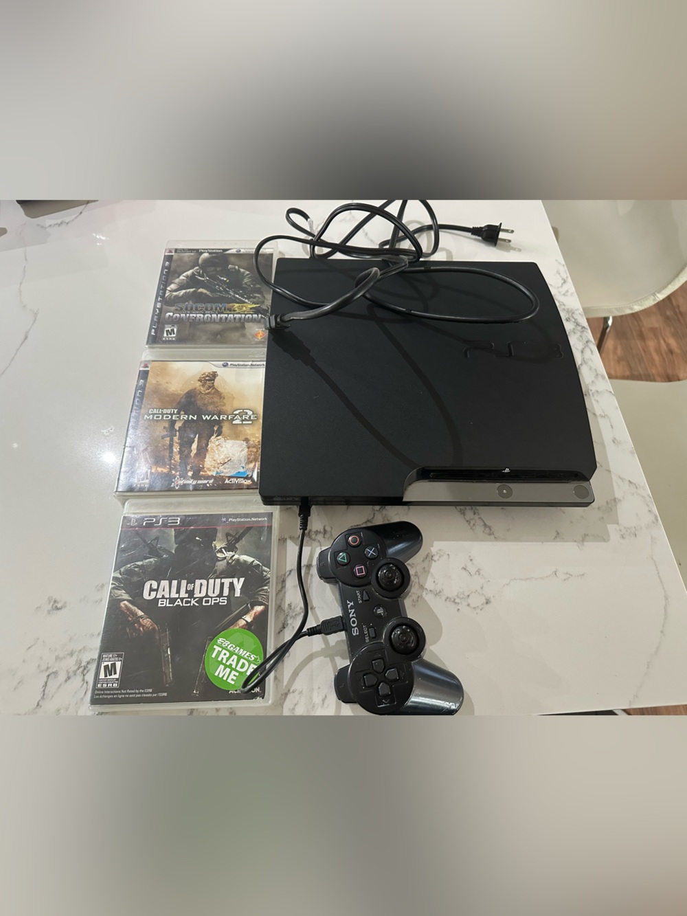 Sony Black PS3 Slim Console with Wired DualShock Controller and Game Discs - Picture 10 of 11